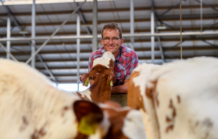 Farmer with calf